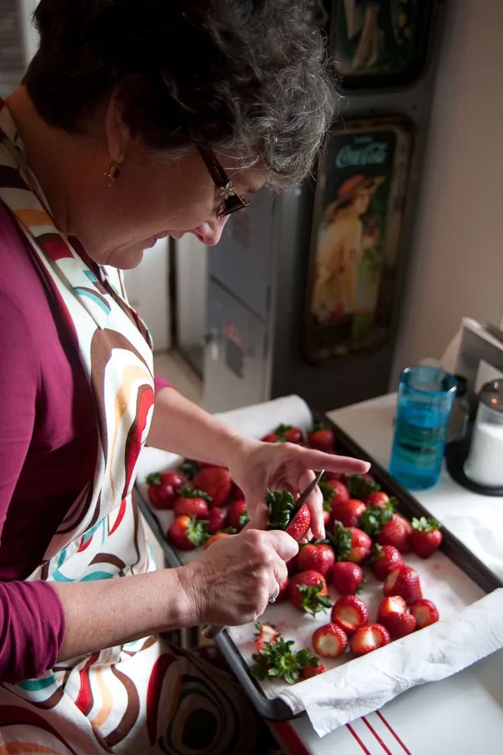 Ann cuts up the berries