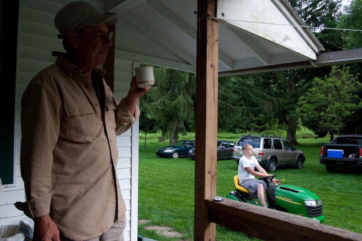 Tim relaxes while the grass is mowed