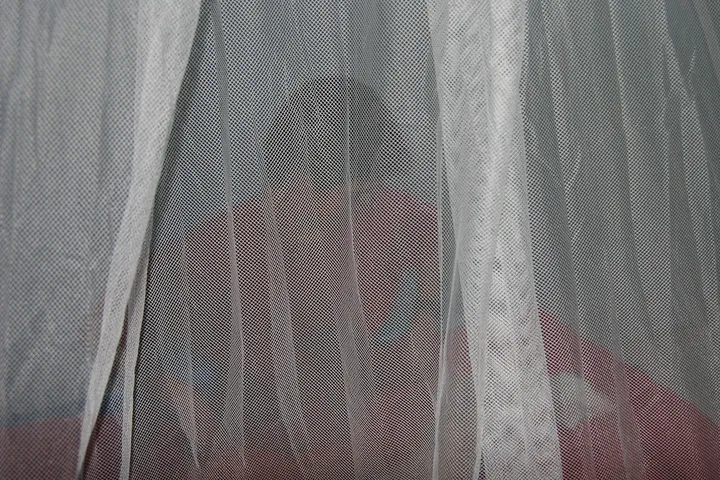 Jen under the mosquito net