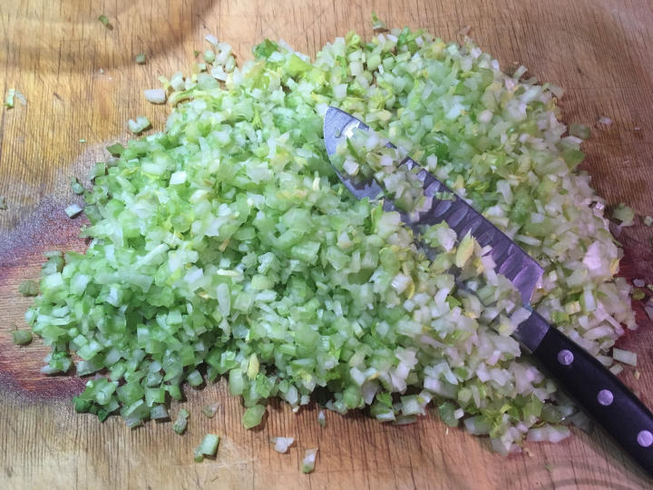 Photo of chopped celery with knife