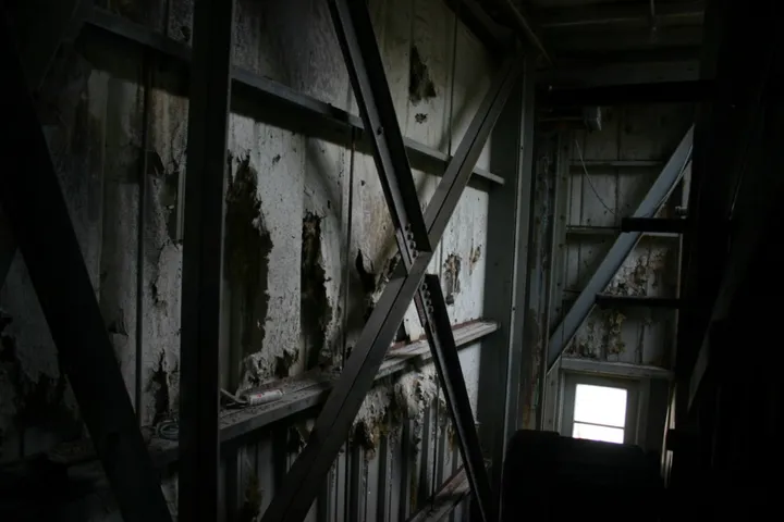 The dark and decaying interior of the first building