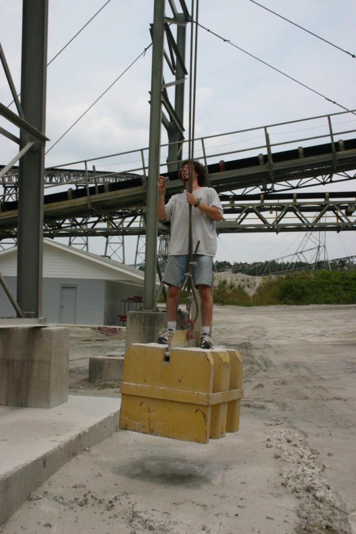 JT on top of a conveyor belt weight