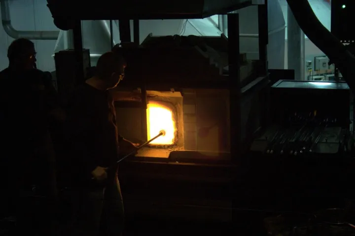 The oven contains over 200 lbs of molten glass