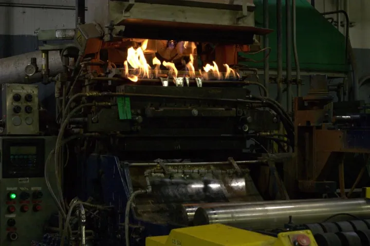 The machine that forms molten lead into plates