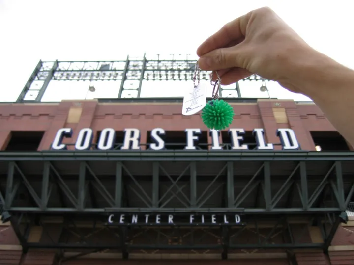 Fuzzy the travel bug visits Coors Field