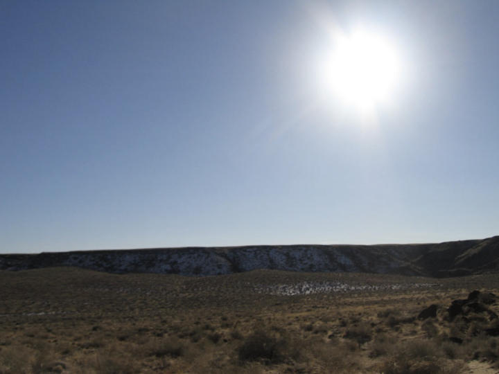 The bright winter sun casts no warmth upon the canyon